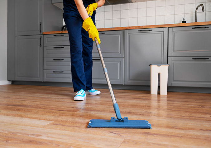 cleaning a timber floor with a mop