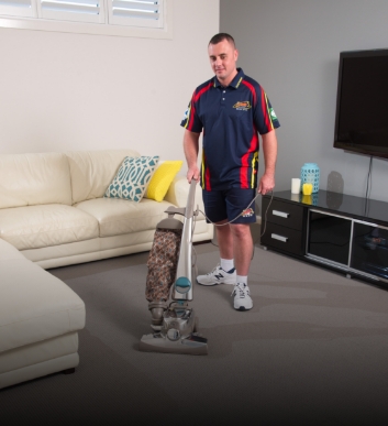 Carpet Cleaning Technician Pre-Vacuum to remove dry soils