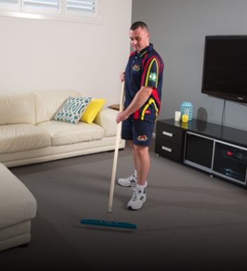 Carpet Cleaning Technician Applying Electro-Shield for Carpet Grooming